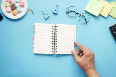 high angle view of open notepad on black backgroundの写真素材