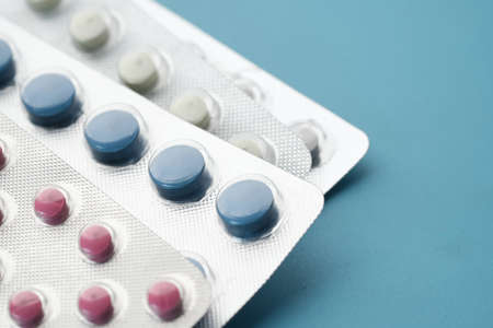 Close up of pills of blister pack on tableの写真素材