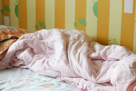 messy bed in early morning , messy bed after waking upの写真素材