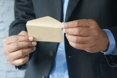 businessman open a envelope close upの写真素材