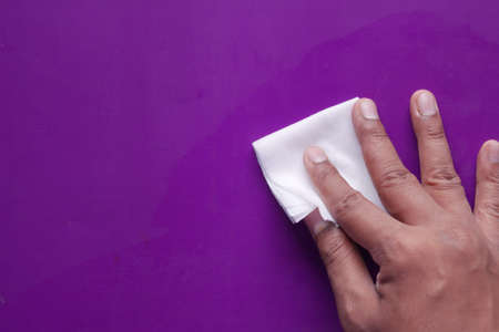 close up of person hand cleaning table with clothの写真素材