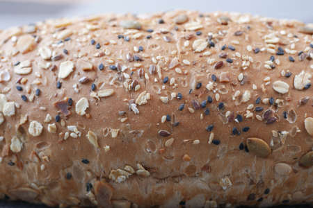 detail shot of whole grain baked bread on tableの写真素材