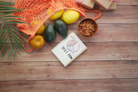 Diet plan with fresh fruits in tableの写真素材