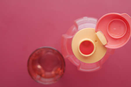fresh eater in a plastic container on red backgroundの写真素材