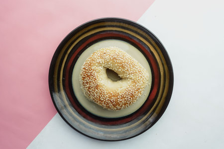 fresh bagel bread in a paper on table