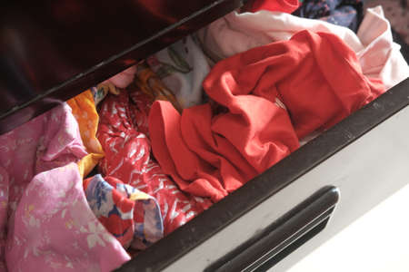 cloths in a open drawer woodenの写真素材