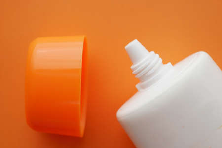 Close up of sunscreen cream in a pink containerの写真素材