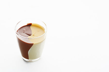 Chocolate cream in a container isolated on whiteの写真素材