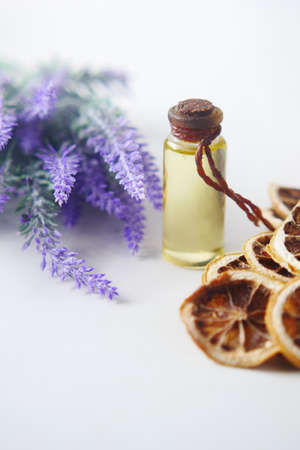Essential lavender oil and flowers on table with copy spaceの写真素材