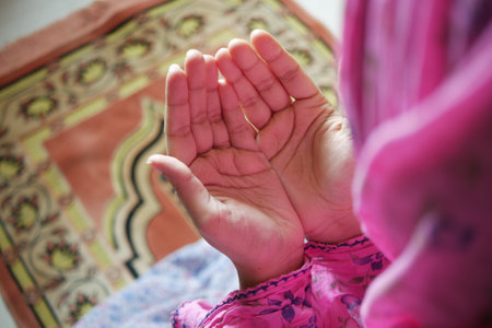 Close up of muslim women hand praying at ramadanの写真素材