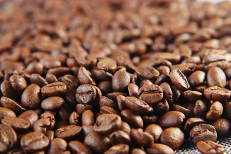 top view of fresh coffee beans on black background with copy space.の写真素材