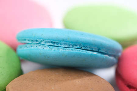 Close up of macaroon on blue background with copy spaceの写真素材