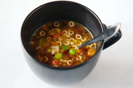 instant cup soup in a mug on tableの写真素材