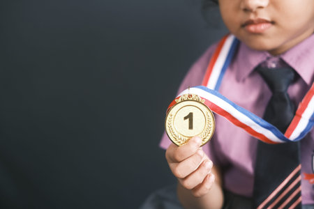 child girl First Place Throphy against gray background