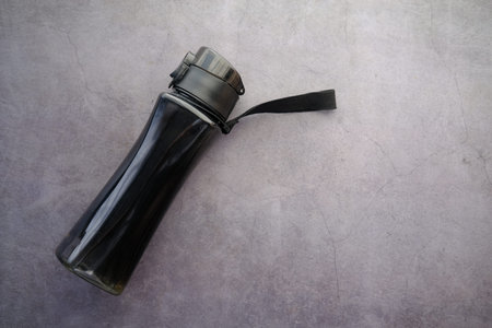 plastic bottle on water on black backgroundの写真素材