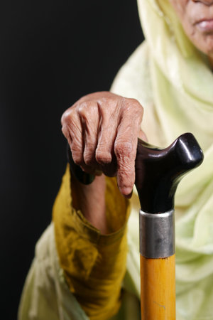 senior women hands on walking stick,の写真素材