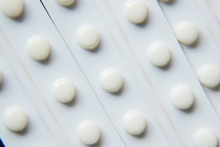 Close up of pills of blister pack on table