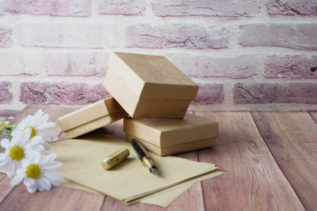 old empty paper, fountain pen and gift box on table