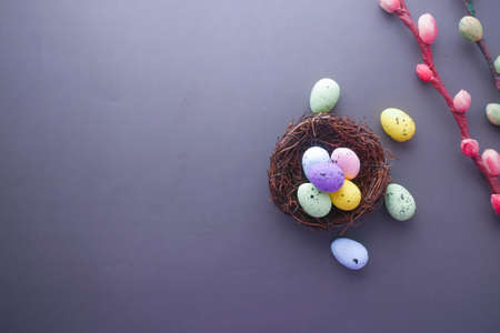 easter concept with multi color egg on black background.の写真素材