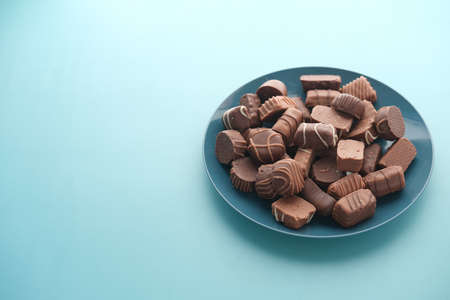 dark chocolate on a plate on table close upの写真素材