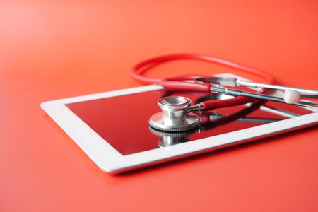 Medical Stethoscope On Modern Digital Tablet On White Backgroundの写真素材