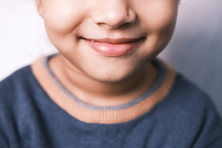 Portrait of child girl looking the camera and laughing.