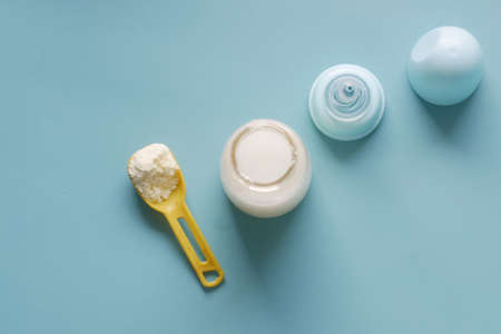 top view of baby milk powder and spoon on tile background.の写真素材