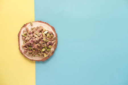 top view of natural pistachios nut on a wooden boardの写真素材