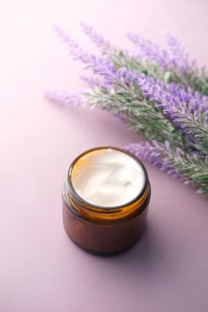 herbal cream cosmetic in a container on table,の写真素材