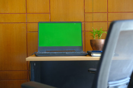 laptop with blank screen on office desk.
