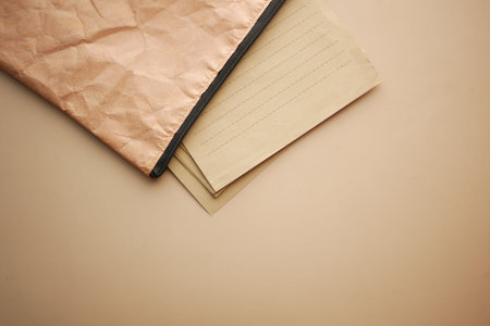 putting paper in a bag on table
