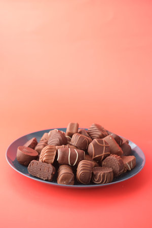 dark chocolate on a plat red background
