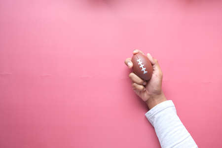 Hand and Finger Strengthening Exercises on red backgroundの写真素材