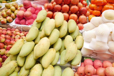 Fresh green mango display for sale at local market