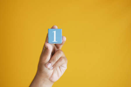 men holding number one close upの写真素材