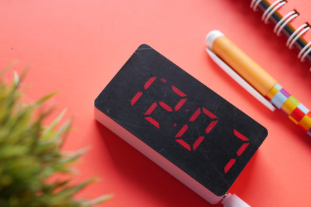 digital clock on red background top down