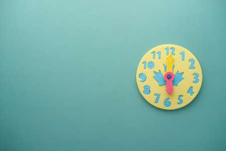 toy alarm clock on color background.の写真素材