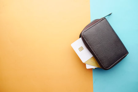 close up of credit cards in a wallet on wooden background