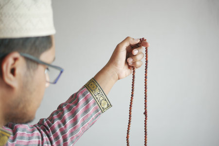 muslim man keep hand in praying gestures during ramadan, Close up