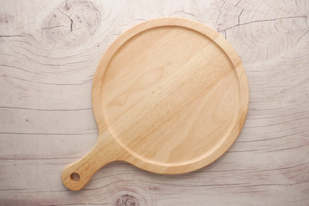 wooden chopping board on a table top view