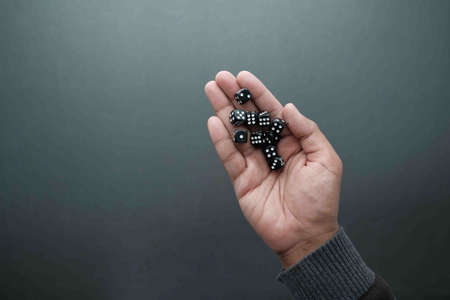 Black Dice trowing on black background top viewの写真素材