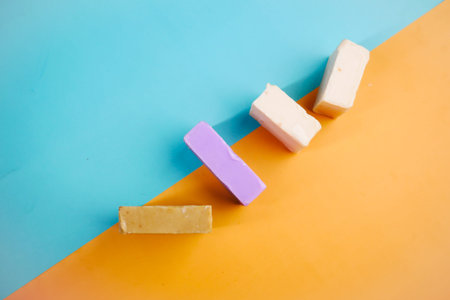 top view of Homemade natural soap bar on color background