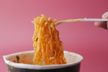 noodles instant in container on red backgroundの写真素材