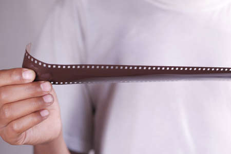 holding a film rolls close upの写真素材