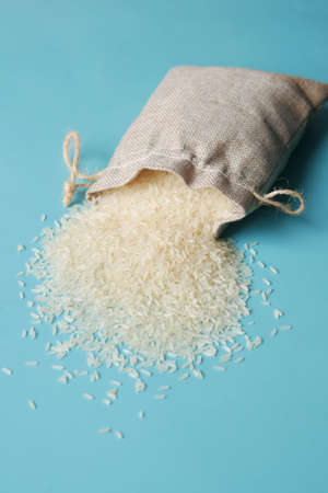 Rice in a bag on table cloth, Top view.の写真素材