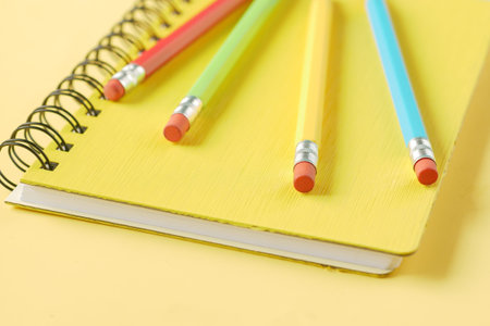Close up of colorful pencils on notepad