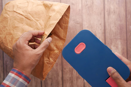 putting a lunch box in a lunch paper packet