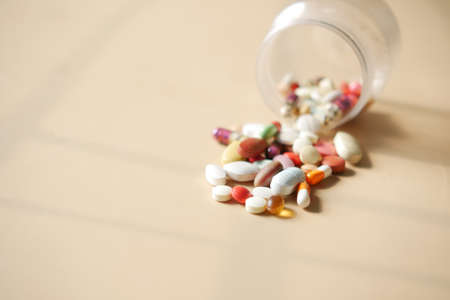 Close up of many colorful pills and capsulesの写真素材
