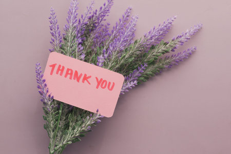 thank you message and lavender flower on purple background
