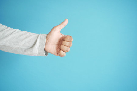 man hand showing a thumb-up